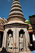 Bangkok Wat Arun - Chinese pagoda at the corners of the Ubosot coutyard with statues of Chinese saints.  